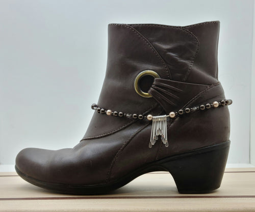 Every step will sparkle when you dress up your boots & booties with the bling in this boot bracelet featuring pewter paddles, greige crystals & bronze & almond crystal pearls