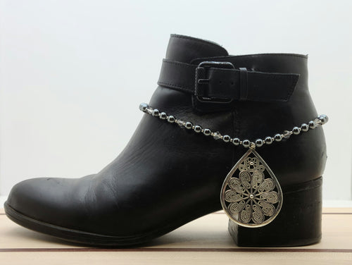 Every step will sparkle when you dress up your boots & booties with the bling in this boot bracelet featuring a focal large pewter teardrop of silver 'ropes', hematite, galvanized Miyuki seed beads, & silver shade crystals
