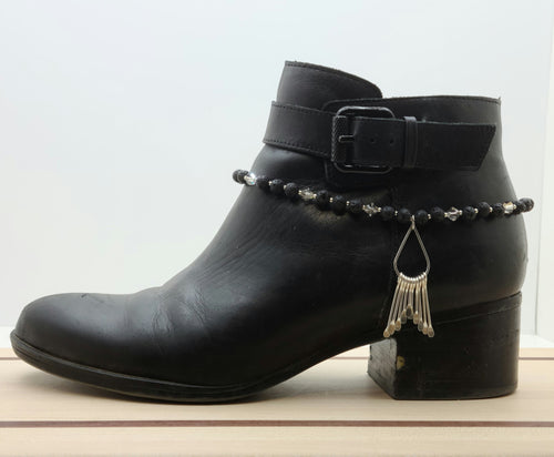 Every step will sparkle when you dress up your boots & booties with the bling in this boot bracelet featuring a teardrop of silver paddles, black lava stone, galvanized Miyuki seed beads, & silver shade crystals