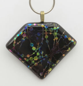 Colorful dots are strung together & randomly grouped in this fun etched dichroic fused glass pendant.