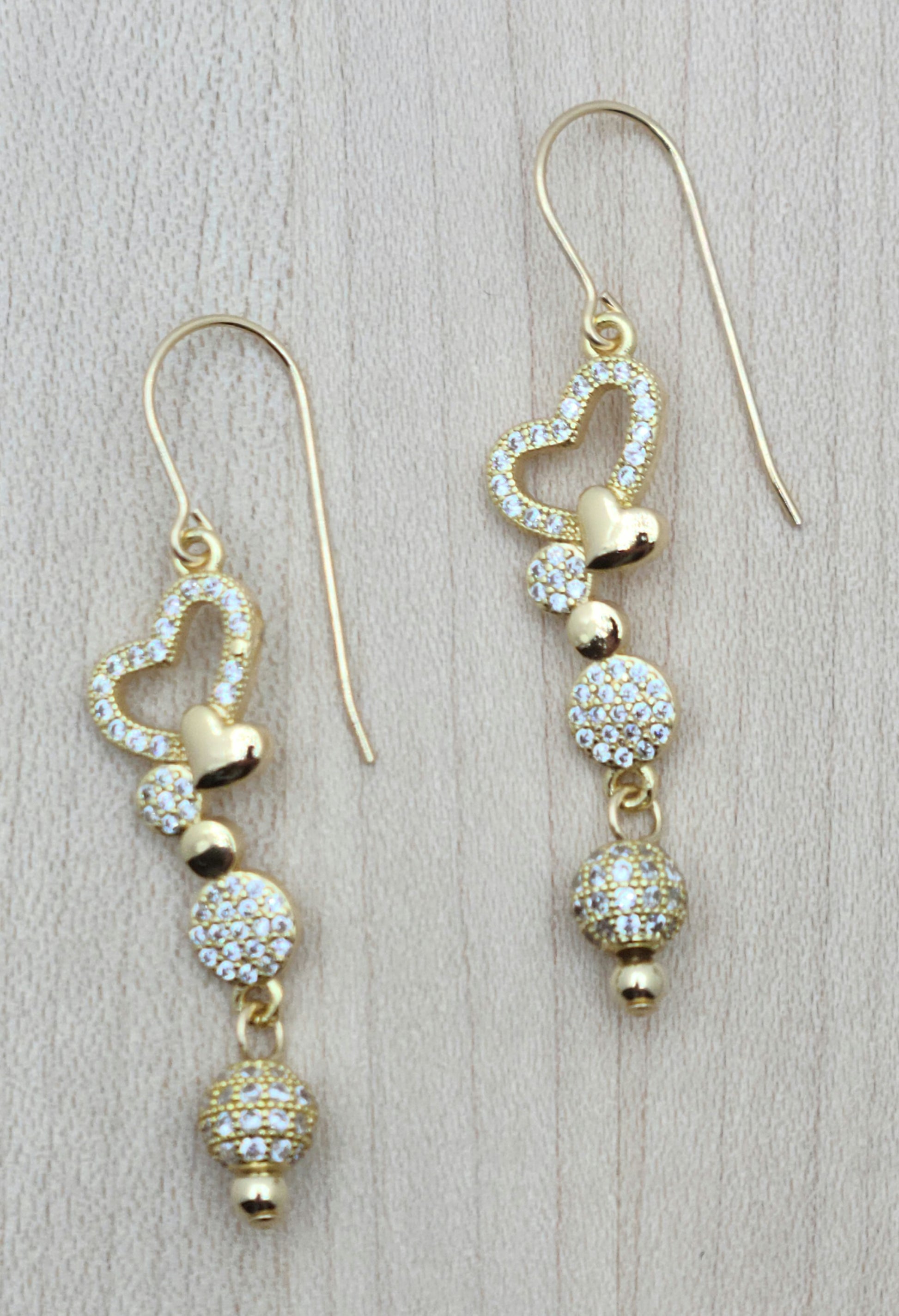 Dangling cubic zirconia hearts & beads are light-hearted fun that will go with anything!