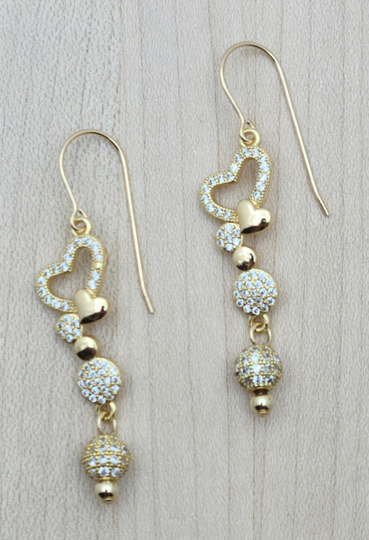 Dangling cubic zirconia hearts & beads are light-hearted fun that will go with anything!