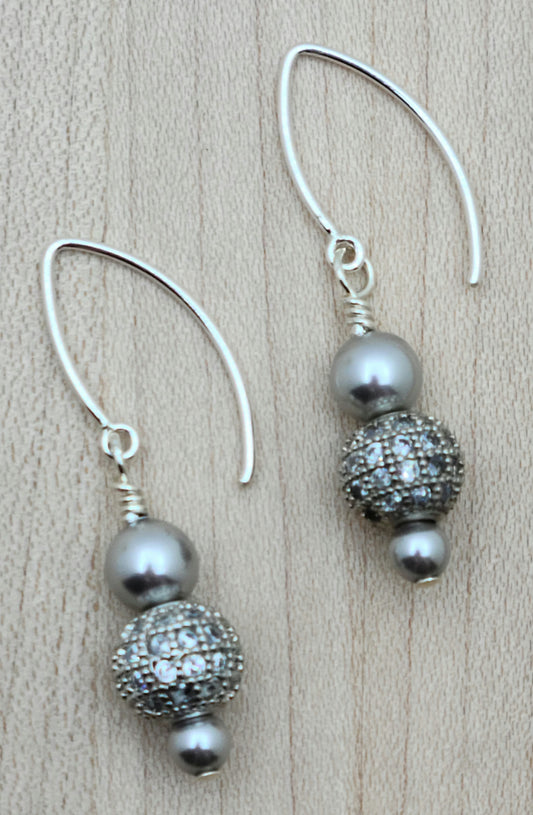 Elevate your style with our Silver CZ Shamballa Earrings. The combination of silver crystal pearls and cubic zirconia encrusted shamballa beads creates a sophisticated look.