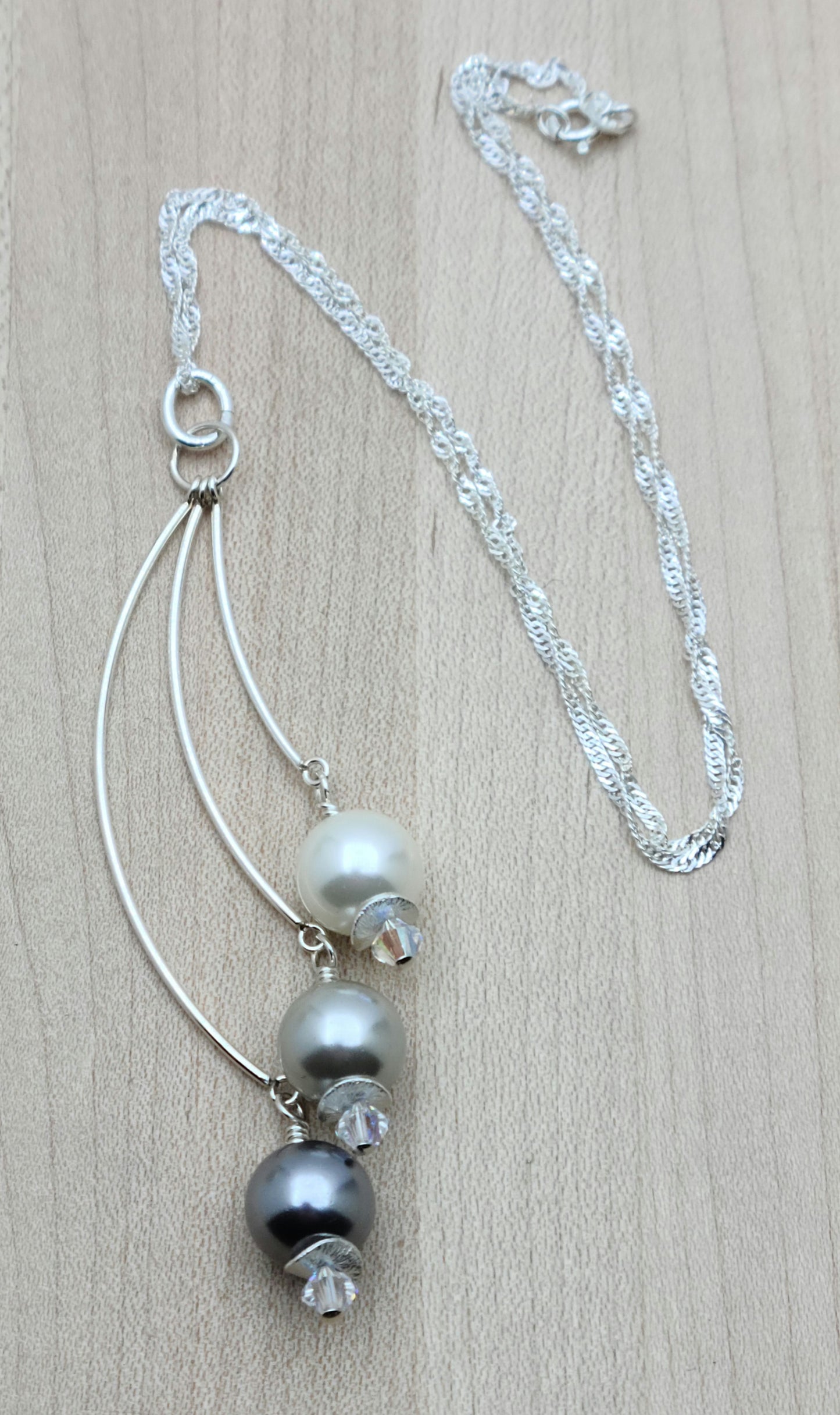 Indulge in the luxurious elegance of my White, Silver & Grey Shell Pearl Necklace.