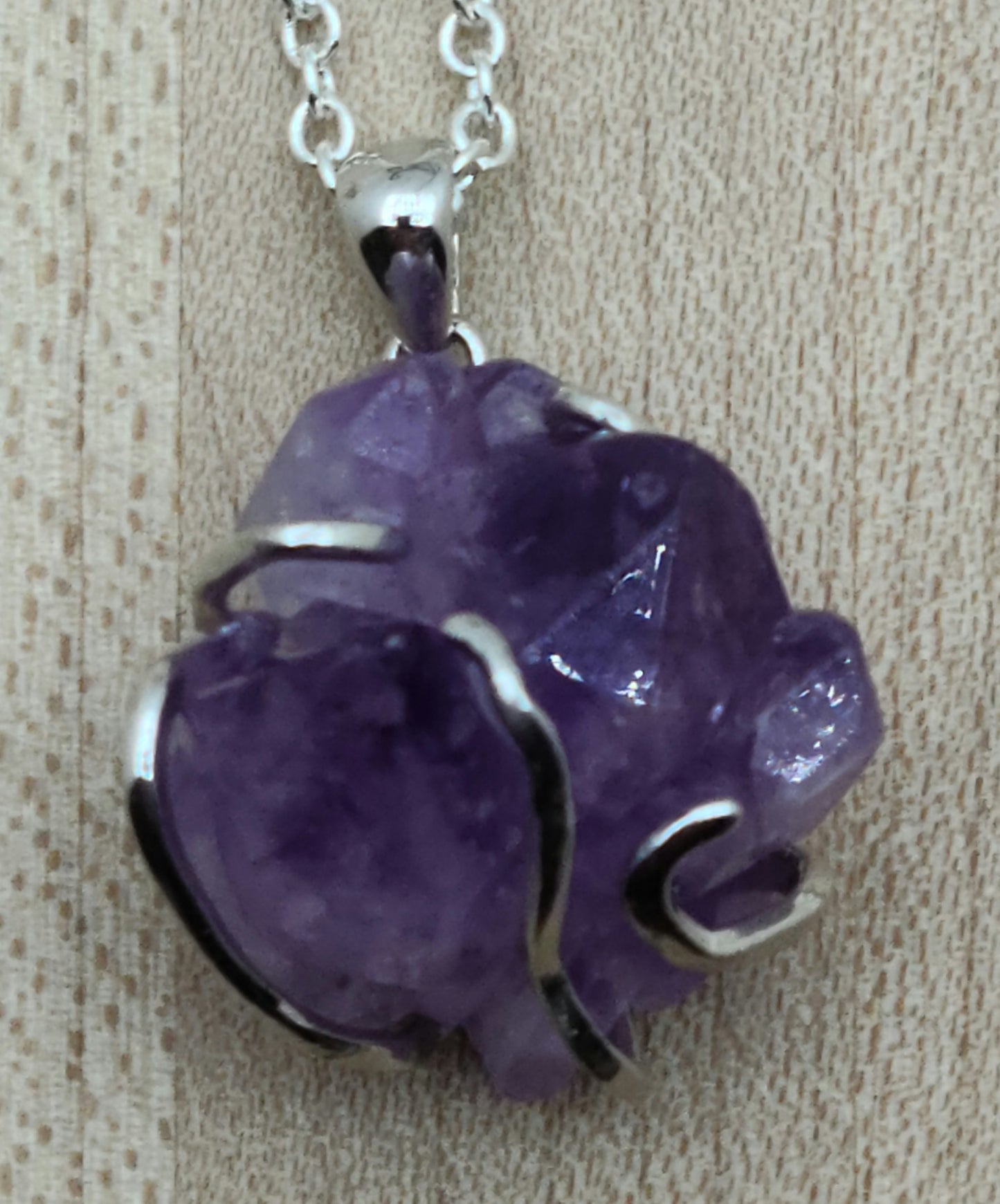 This striking amethyst rock is 'hugged' by a free form sterling silver bail for a very free-spirited look!
