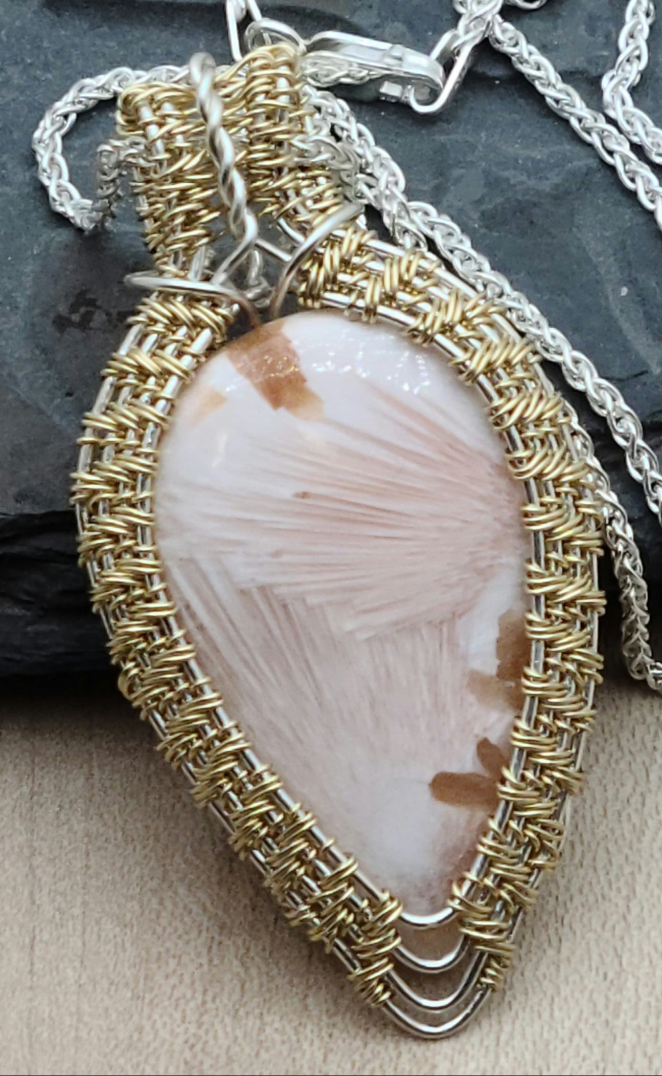 Pink Scolecite framed with woven gold fill over silver fill wire
