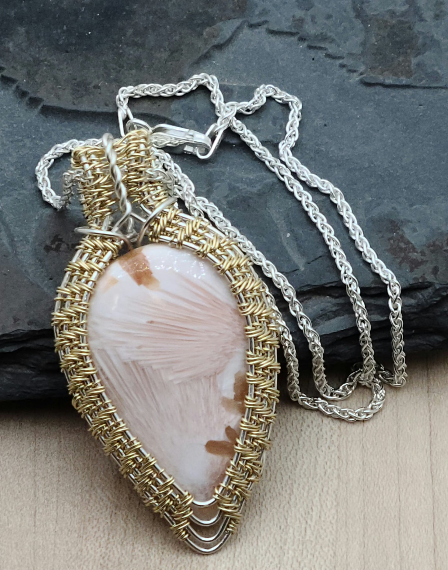 Pink Scolecite framed with woven gold fill over silver fill wire