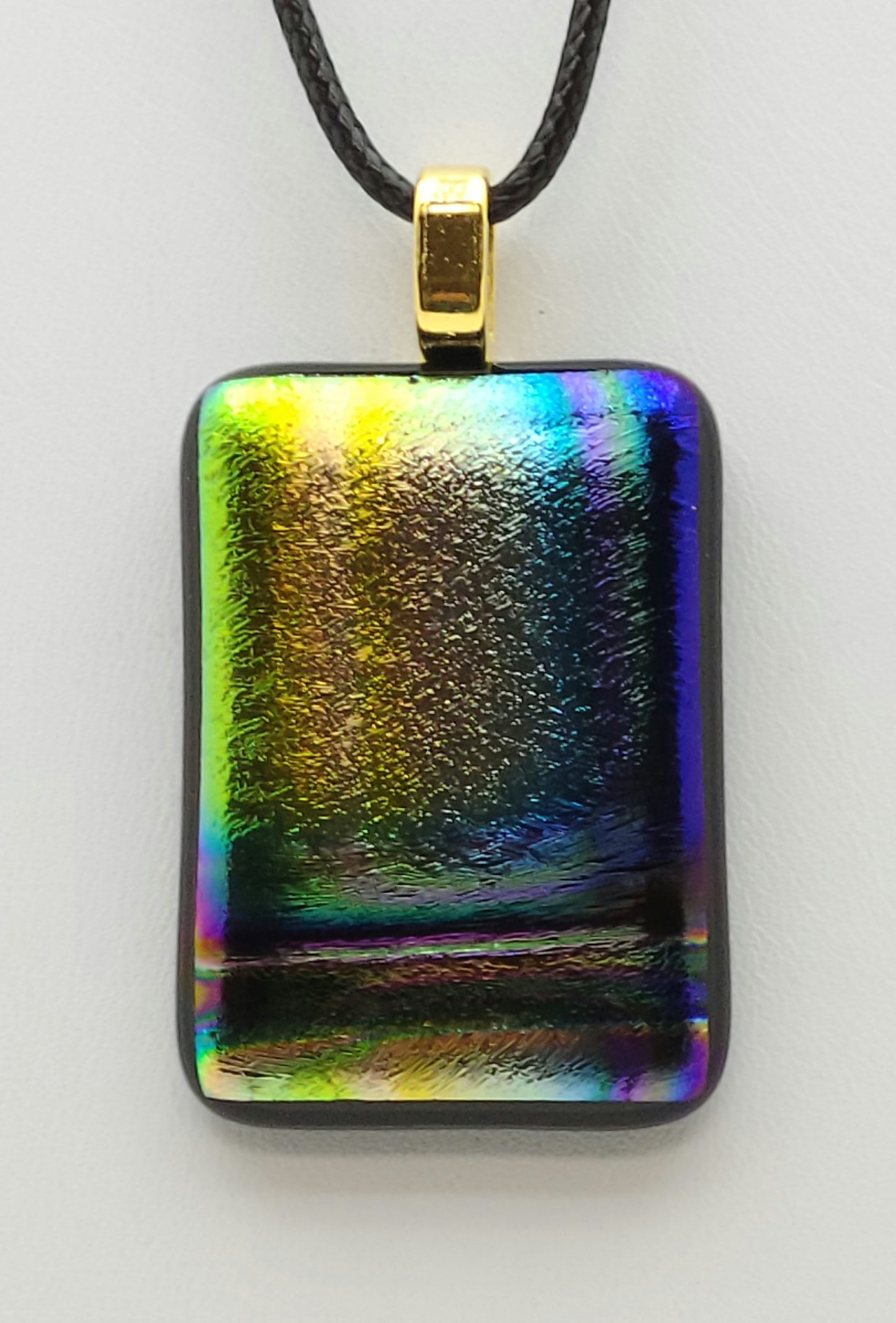 Rainbow colors dichroic velvety fused glass pendant.