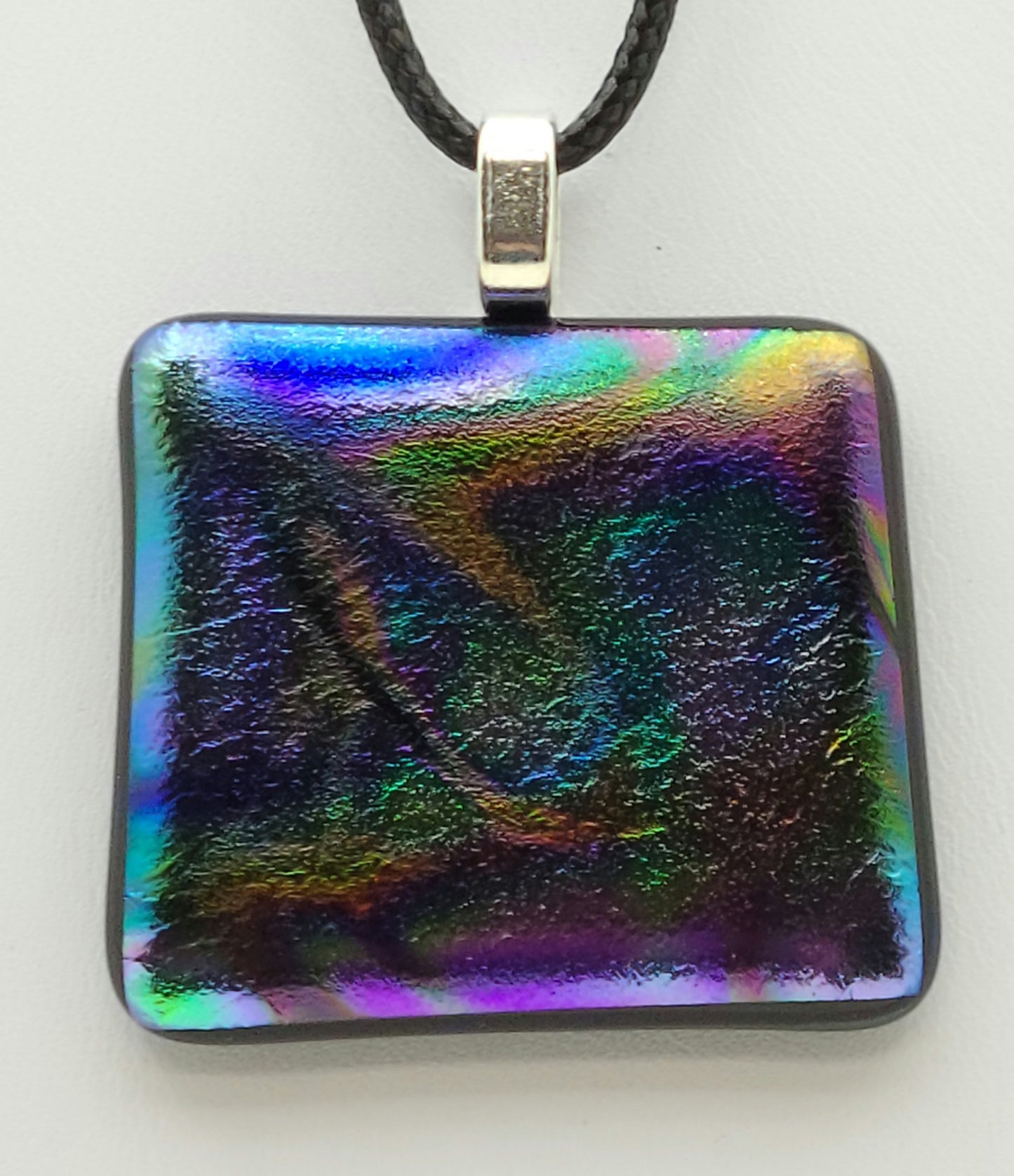 The dichroic fused glass pendant will remind you of the aurora borealis!