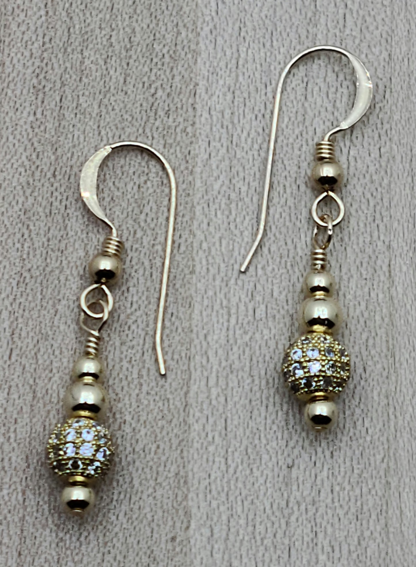 gold filled fish hook earrings elegantly showcase CZ shamballa beads.