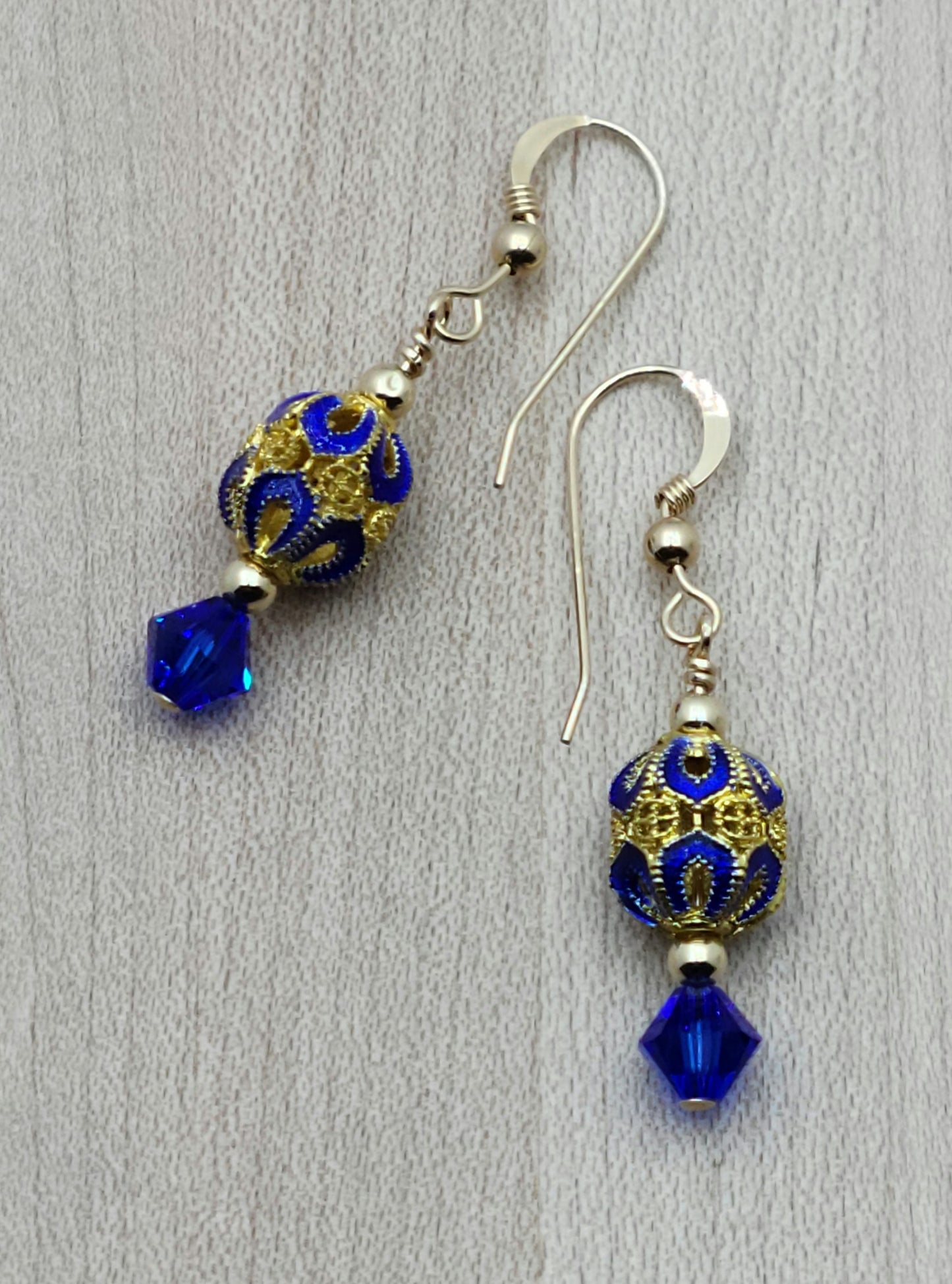 The deep, bright blue & gold of these filigree cloisonné beads are definitely gorgeous & pairing with crystal & gold filled findings creates a look of elegance.