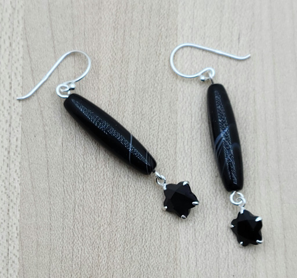 Sterling silver set black cubic zirconia 'flowers' add sparkle to lovely, long tibetan 'tuxedo' barrels. Dramatic without overstatement or weight!
sterling silver fish hooks