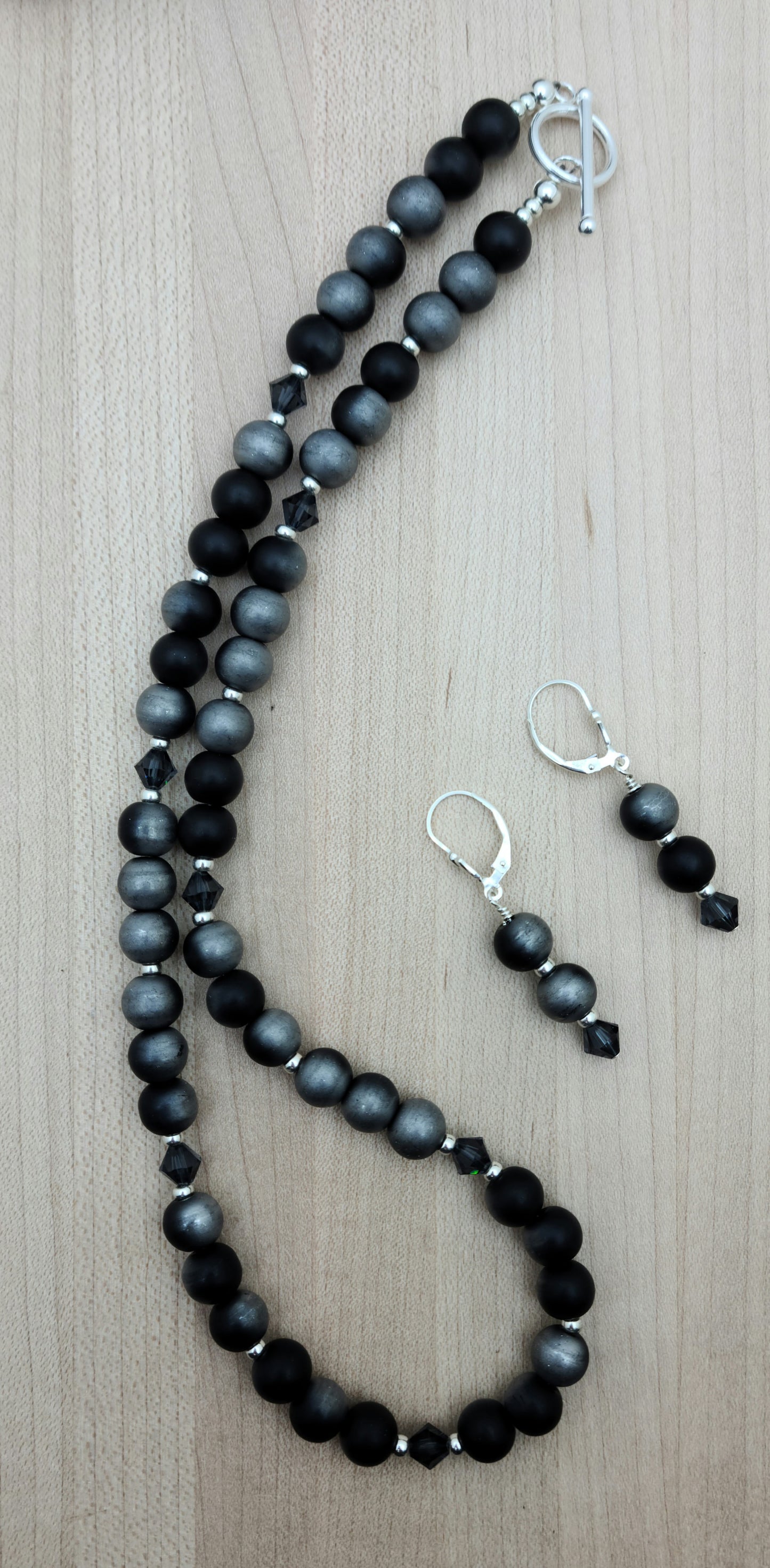 You'll totally love this set!
Titanium has been permanently bonded to agate beads to create a satiny, nuanced black and silver. They're absolutely gorgeous! I've interspersed graphite crystals and galvanized silver Miyuki seed beads for a touch of contrast.
toggle clasp & lever back earrings