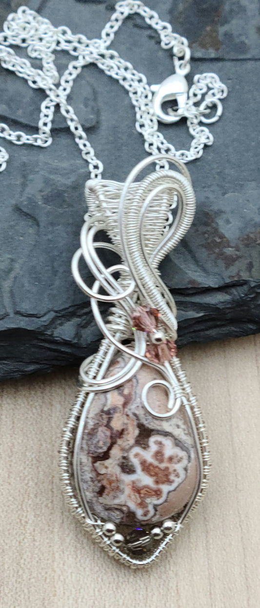 Introducing your new favorite conversation starter—this gorgeous rosita jasper & crystal woven wire pendant!