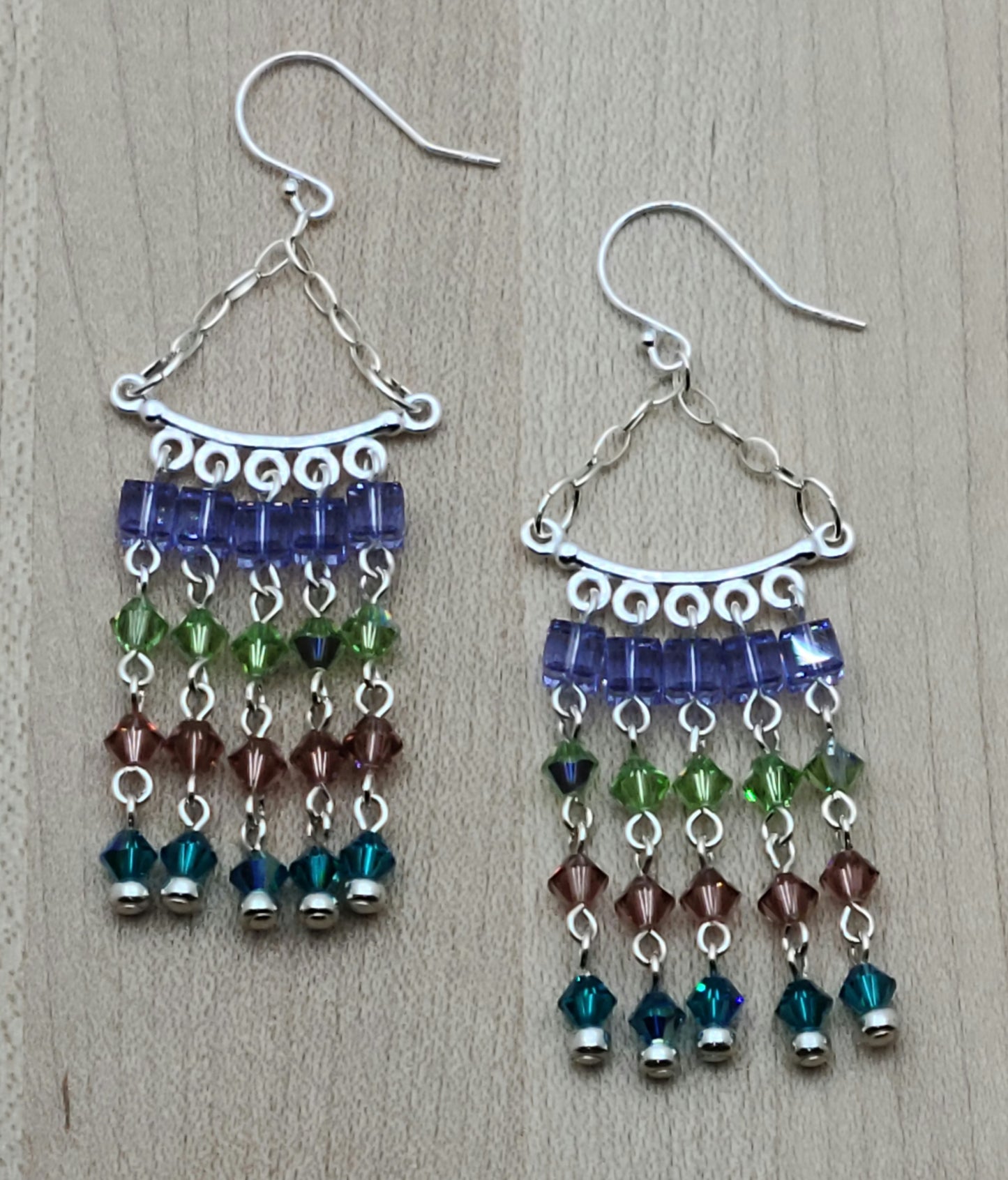 Movement, color, & sparkle will define your ears with these crystal chandelier beauties! 2 5/8" with sterling silver fish hook ear wires.