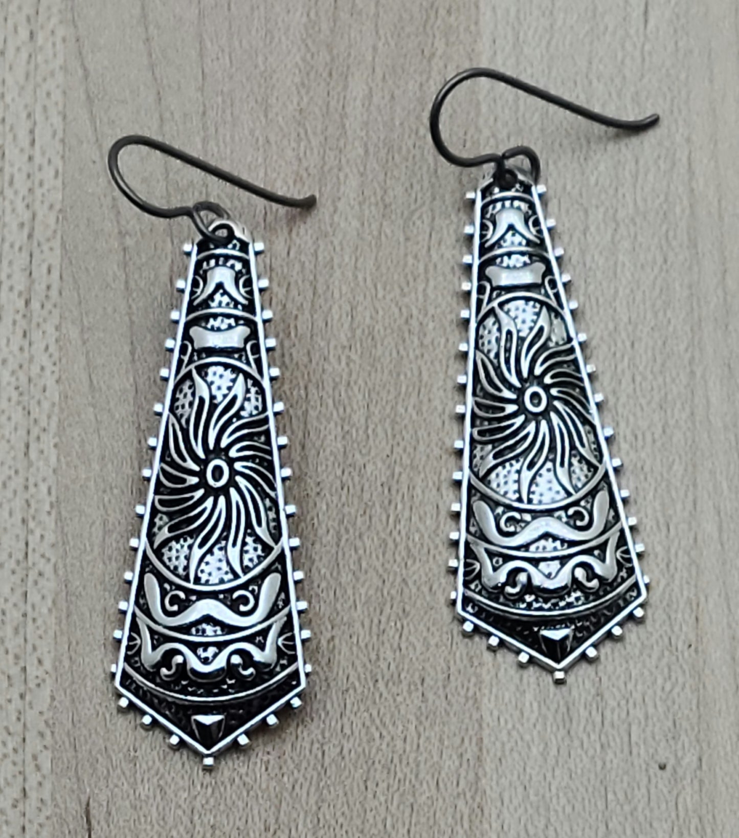 These stamped, lead-free pewter earrings have interesting geometric designs and are extremely lightweight. A lot of bang without the weight!