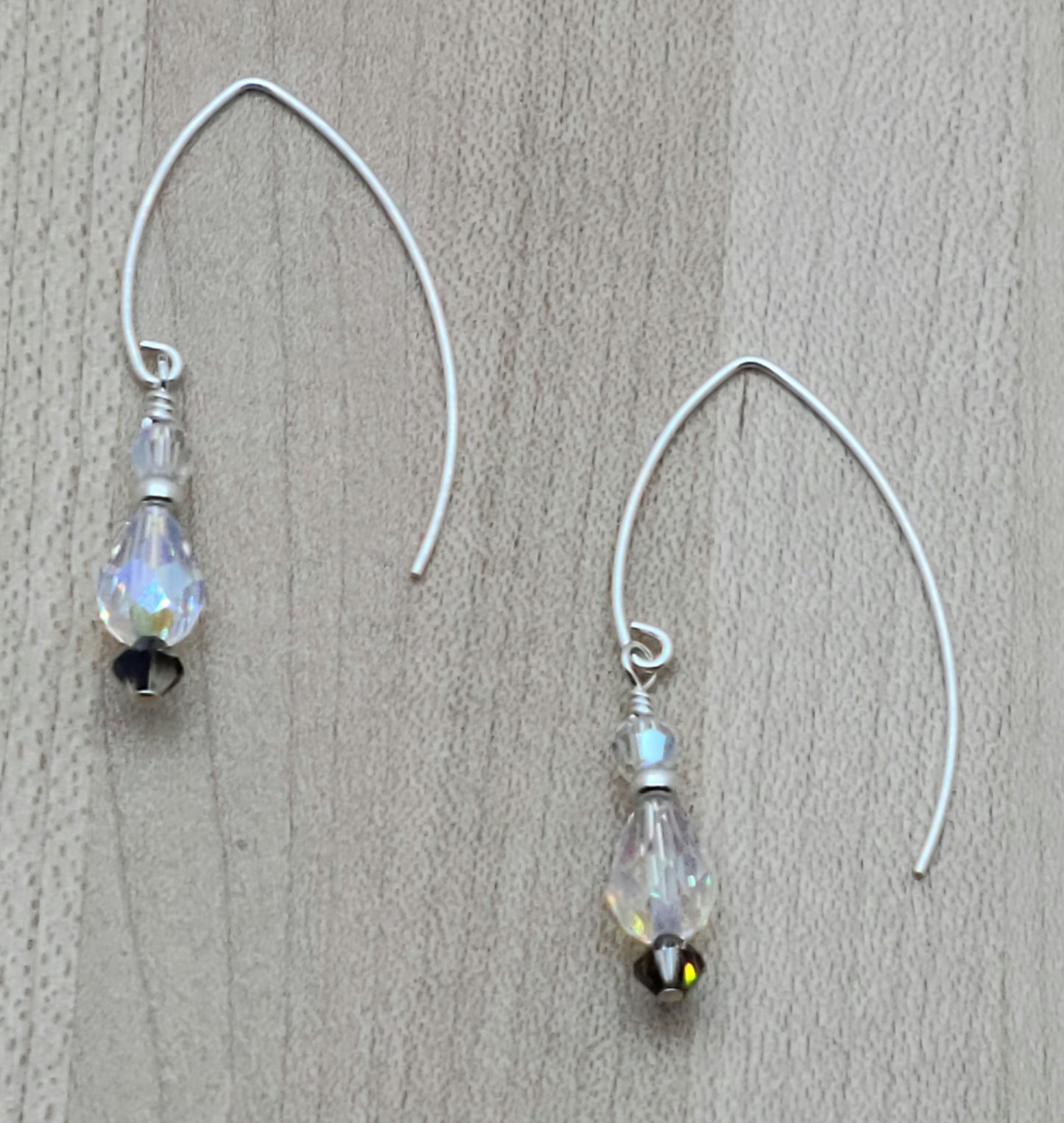You'll be drawn to the shimmery aurora borealis coating if the crystals in these long fish hook earrings.