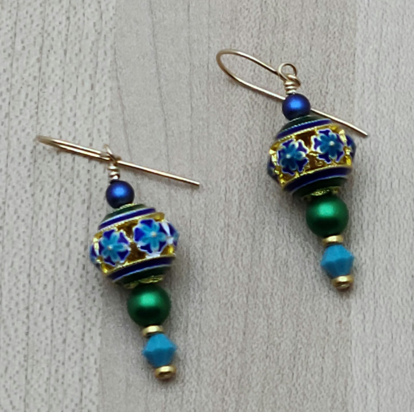 You'll smile every time you wear these vividly colored cloisonne beads of turquoise, blue, green, & gold! I've added equally bright & complimentary colors of crystal pearls and crystals for a lovely set.
