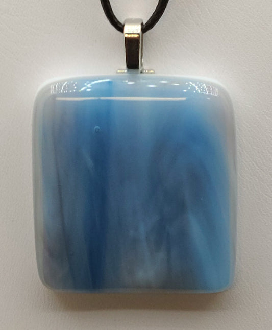 Feel the rush of a waterfall with this stunning blue pendant.