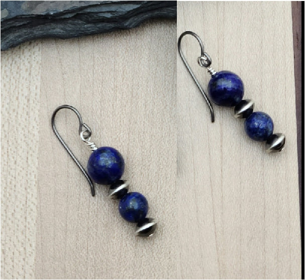 Lapis lazuli is a beautiful stone, prized for its deep blue color. It is said to promote wisdom & self-awareness. Navajo style silver is a lovely, often oxidized sterling silver. Together they create lovely earrings.