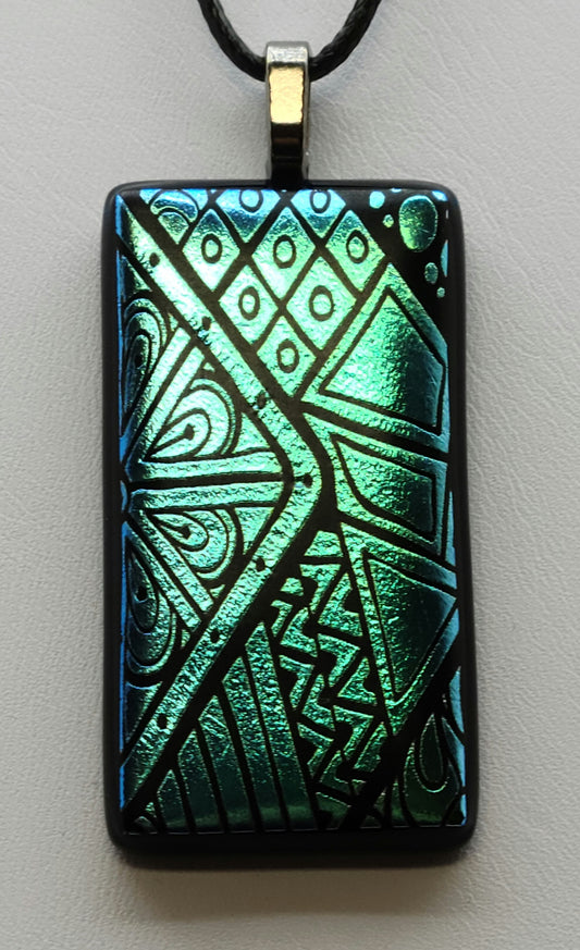 Indulge in the sophistication of our Teal Geo Fused Glass Pendant.