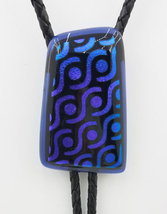 bolo tie of blue & lavender geometric designed dichroic glass with black leather