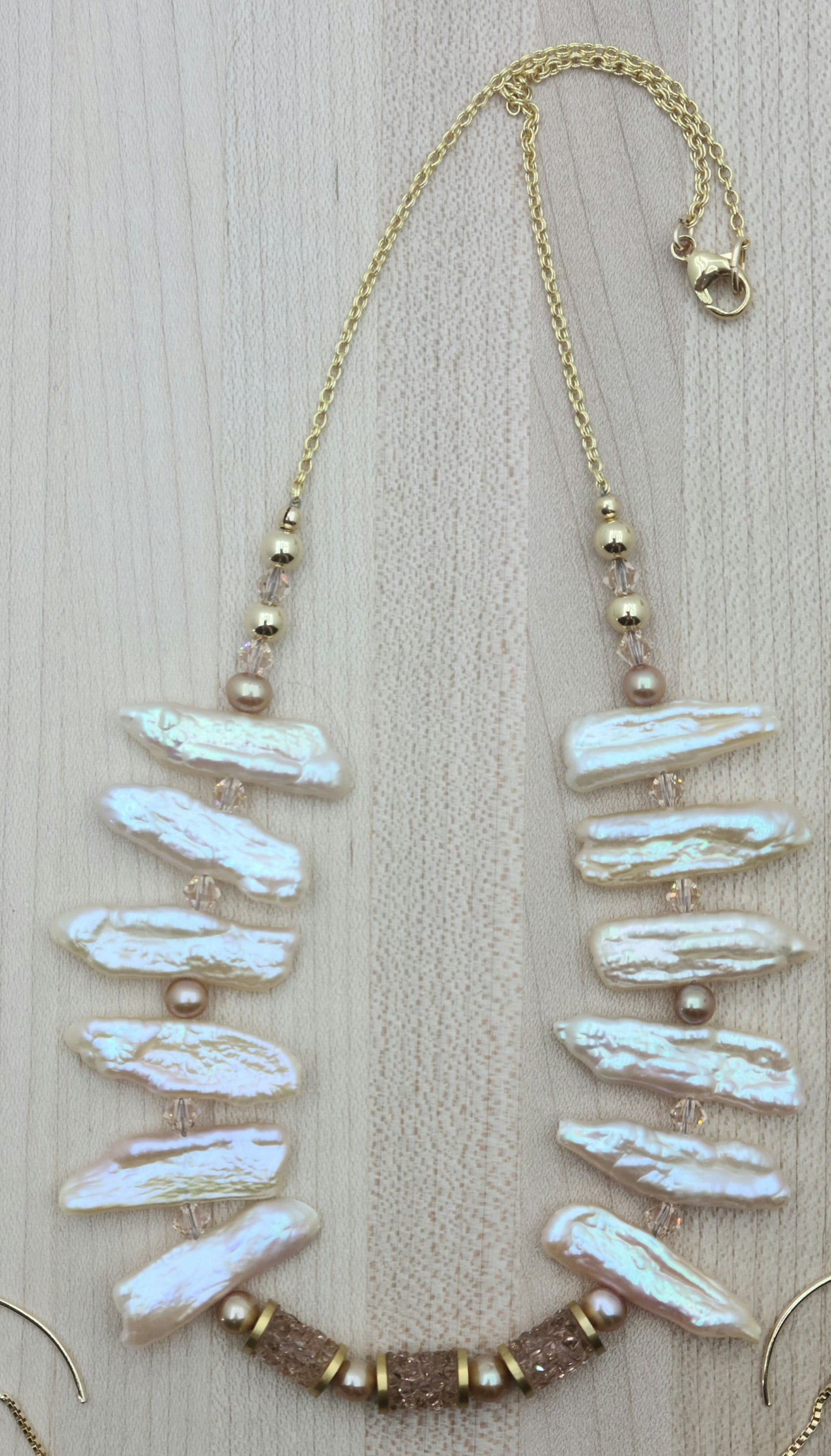 The color & luster of these biwa pearls is lovely - exactly like a tropical sunrise! The antique rose fine rock crystals tubes add lots of bling to the pearl jewelry necklace & earrings!