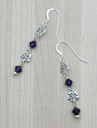 Deep, velvety purple crystals & sweet sterling silver flowers make up these lightweight, but attention grabbing earrings!