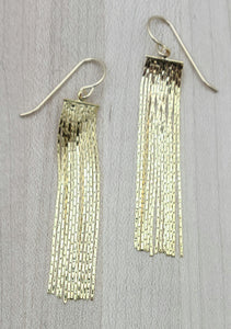 Tiny herringbone chain dangles create these fun gold plated earrings!