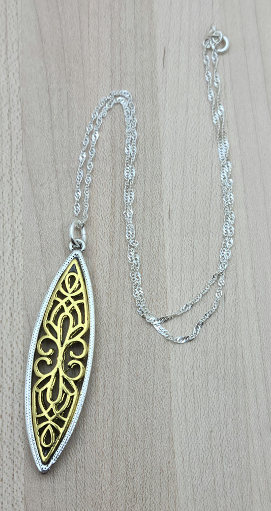 This gold filigree & silver bordered pewter marquis pendant is very striking!