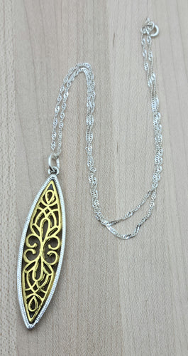 This gold filigree & silver bordered pewter marquis pendant is very striking!