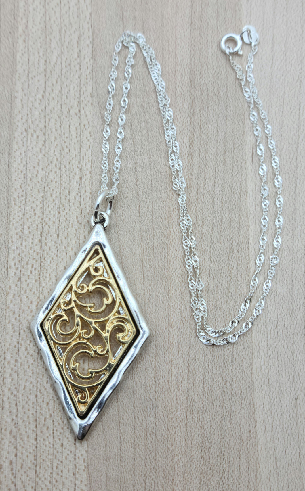 This gold filigree & silver bordered pewter diamond pendant is very striking!