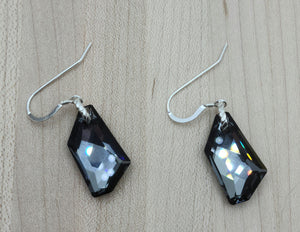 A large modern crystal pendant, dark grey with cool undertones, makes these crystal earrings both sophisticated & elegant.