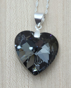 This beautiful crystal heart is a compliment to any attire and will always be admired! The focal is a large, dark grey, yet sparkling crystal heart pendant.