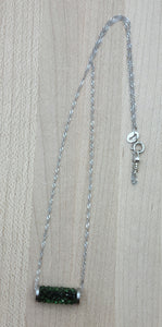 So simple, yet eye catching! The focal is a tube comprised of erinite green crystal 'rocks' on a sterling silver chain.