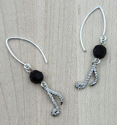 Show the world you're a lover ofr music with these pave encrusted eighth notes hanging from round black crystals.