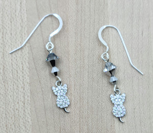 These pave CZ encrusted kitties are sittin' pretty below silver crystals. Folks will know you're a cat lover!