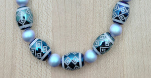 Iridescent light blue crystal pearls & light blue crystals fit perfectly with these beautiful tribal design etched crystal beads!  