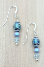 Iridescent light blue crystal pearls & light blue crystals fit perfectly with these beautiful tribal design etched crystal beads!  Fish hook earrings