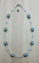 These beautiful tribal design etched crystal beads are set off with azure crystals* & liquid silver!  They're sure to garner attention when worn!  Necklace