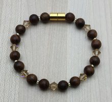 Rosewood is said to represent romantic love & sincere blessings. Paired with light light topaz crystals & gold, it is warm & inviting. bracelet  with magnetic clasp