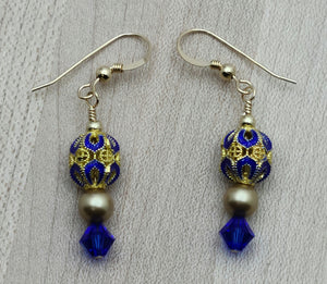 Brilliant blue & gold cloisonne beads, crystals* & crystal pearls* team up for an eye-catching earrings.