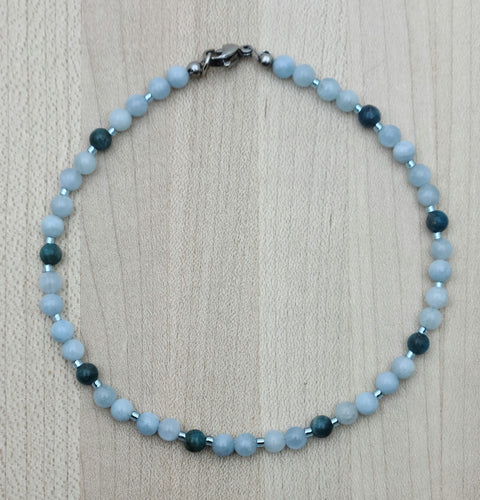 Dress up your ankle with a lovely, eye-catching anklet of pale blue aquamarine & dark blue apatite, accented by pale blue Miyuki delica.