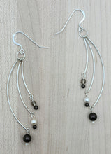 Dramatic 3", 3 curved sterling silver bars host the same chocolate &amp; cream crystal pearls* and hang from sterling silver fish hook ear wires.
