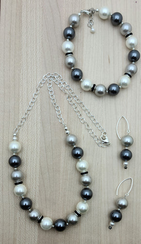 These large shell pearls of silver, white & black are SOOooo pretty! They're paired with lovely crystal rondelles. You'll feel so well-dressed wearing this shell pearl jewelry set of necklace, bracelet, & earrings.