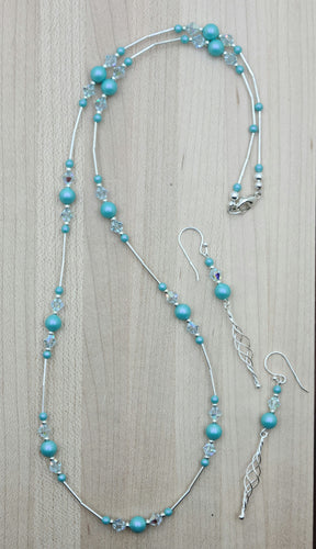 This iridescent turquoise necklace & earrings set is a gorgeous shade! Liquid argentium silver separate groups of crystal pearls & crystals!