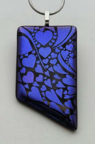 Hearts EVERYWHERE in this eye-catching purple etched dichroic statement fused glass pendant!