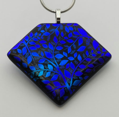 Brilliant azure blue dichroic branches & leaves are etched into this stunning fused glass pendant!