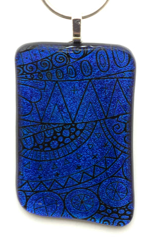 Clear capped & cold worked, this deep blue etched boho design dichroic fused glass pendant is a definite statement piece!