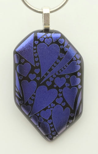 A myriad of etched dichroic violet hearts are scattered over this lovely fused glass pendant!